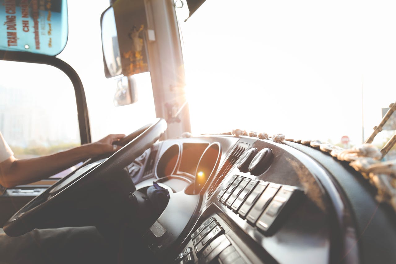 Person Hand On Steering Wheel